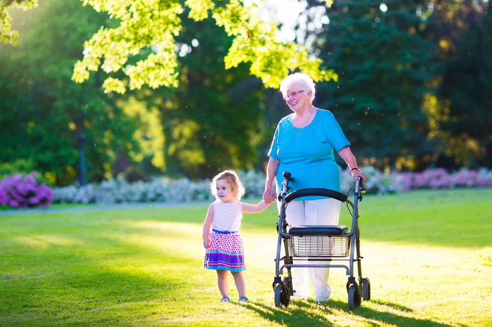 Lady With Grandchild — Mobility Shop In Tweed Heads, NSW