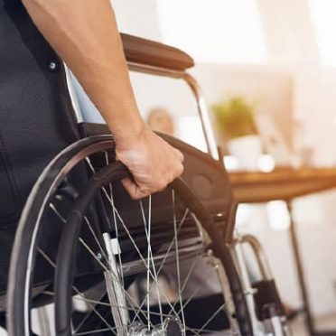 Man In A Wheelchair — Mobility Shop In Tweed Heads, NSW
